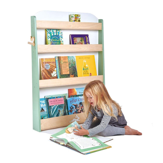 Child reading a book in front of Tender Leaf Forest Bookcase