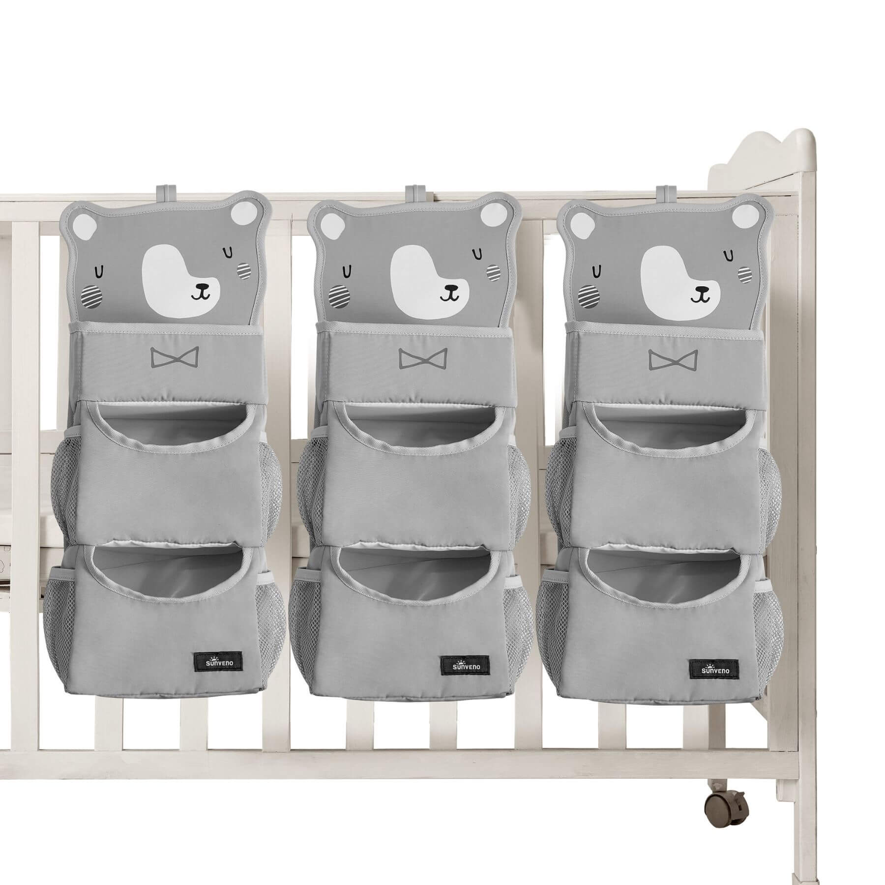 Three Forest Friends Hanging Organizer bear on a white crib.