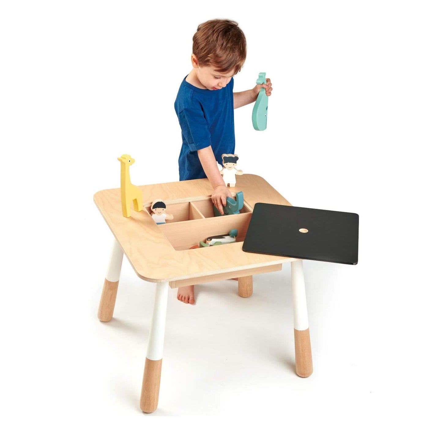 Child playing with aTender Leaf Forest Table on a white background