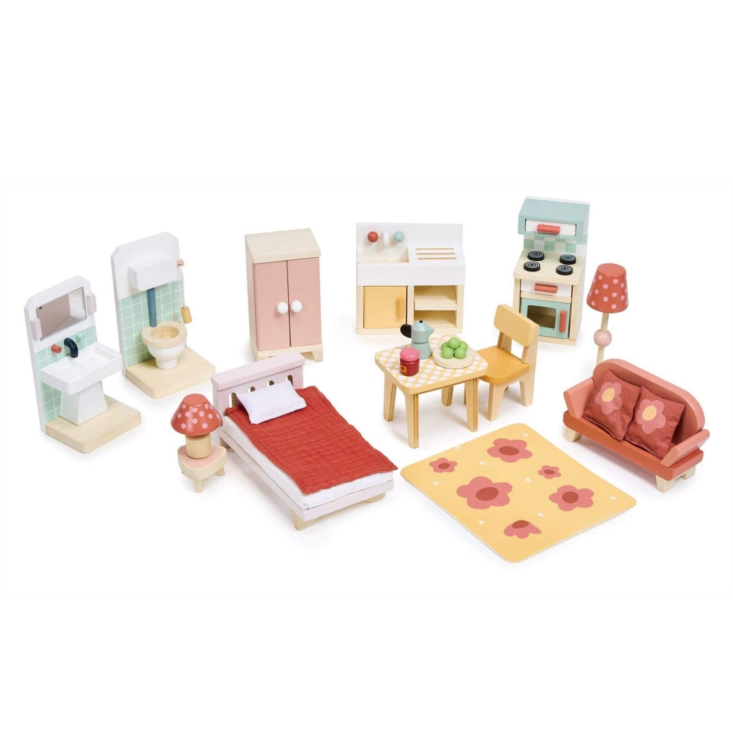 Set of wooden toy furniture including a bed, sofa, and kitchen on a white background