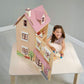 Child playing with Tender Leaf Foxtail Villa Pink on a table