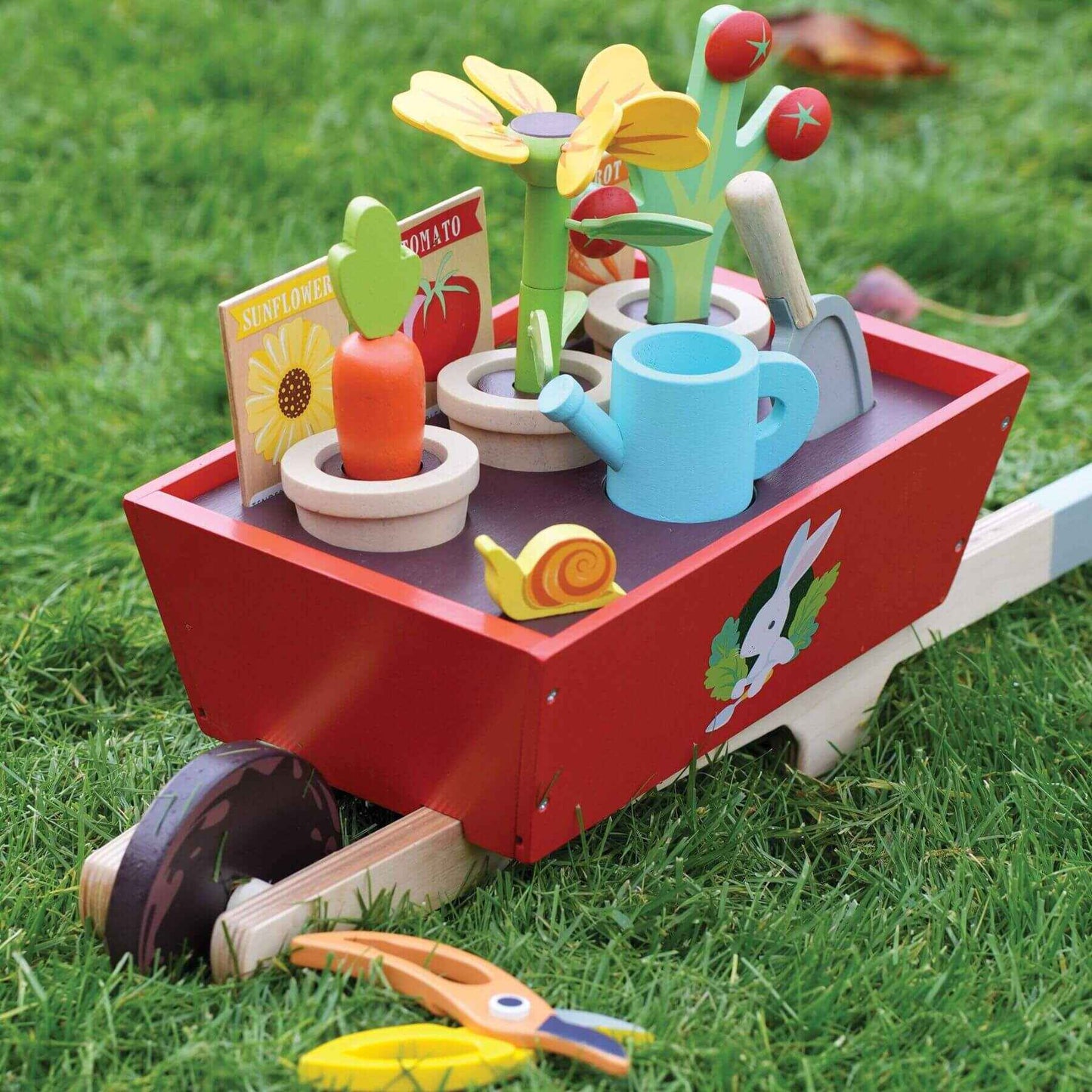 Tender Leaf Garden Wheelbarrow Set on grass