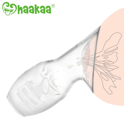 Clear silicone breast pump with floral design on a white background, featuring the Haakaa brand.