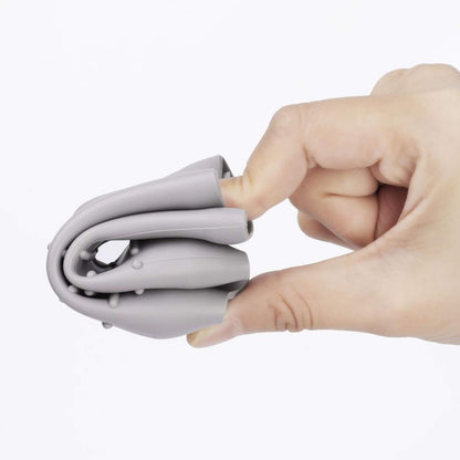 Hand holding folded bottle silicone cover