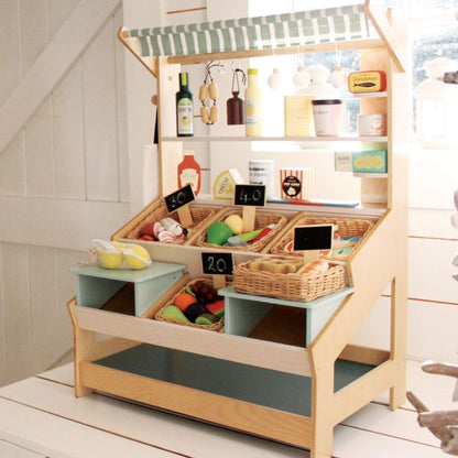 Tender Leaf General Stores with various toys and items on shelves.