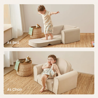 Child playing on Tiny Land® GentleSnug Kid Chair Beige White that can be used as a bed or chair.
