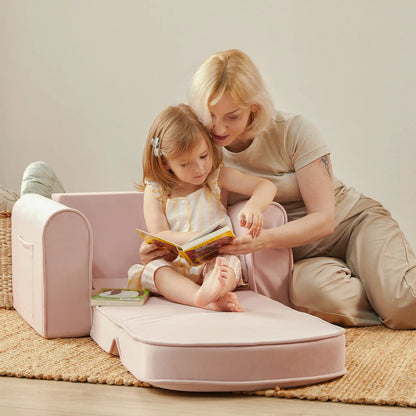 Woman and child reading a book on Tiny Land® GentleSnug Kid Chair Pink
