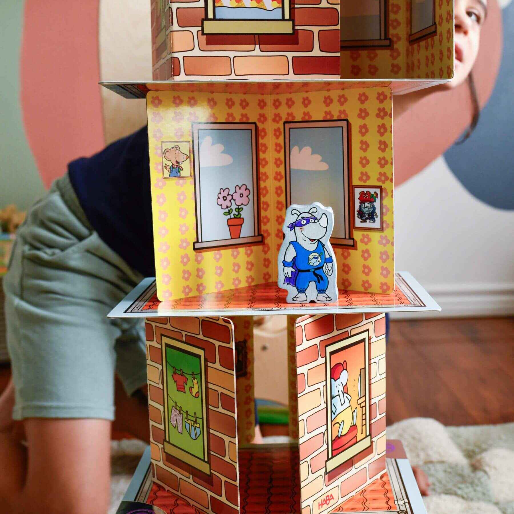 Child playing with Giant Rhino Hero XXL Stacking Cards Game
