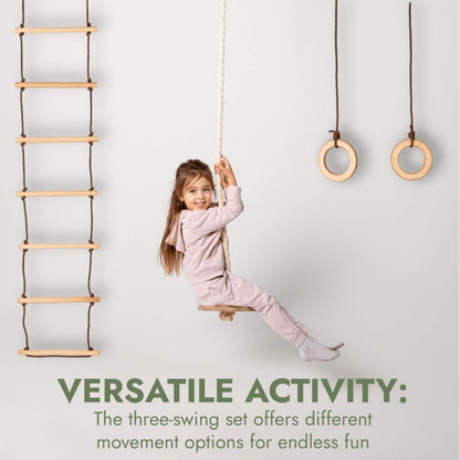 Child playing with a wooden swing set against a white background