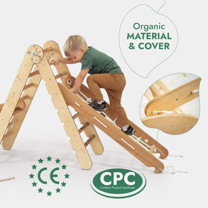 Child climbing a wooden slide with organic material and cover, featuring CE and CPC logos.