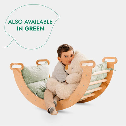Child sitting in a wooden rocking chair with a teddy bear, on a white background with text 'Also Available in Green'.