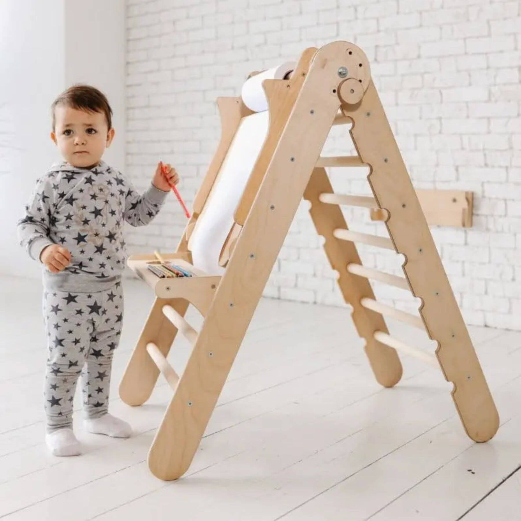 Child playing with Goodevas Art Addition on the Triangle Ladder