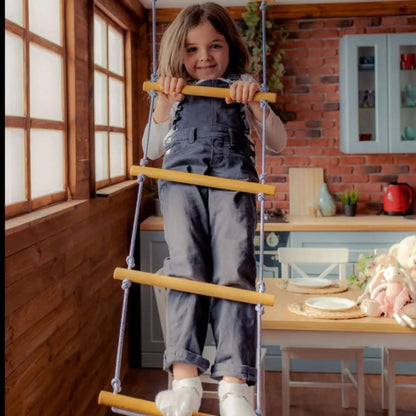 Child on Goodevas Climbing Rope Ladder in a dining room.
