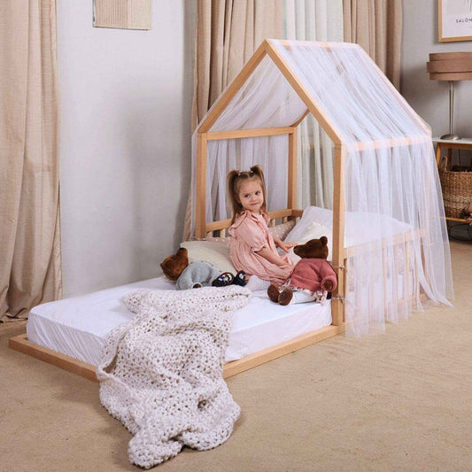Kid Sitting on Goodevas Wooden Montessori House Floor Bed, in bedroom