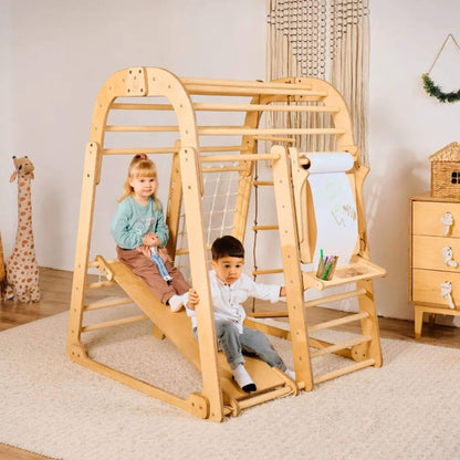 Children playing on Goodevas Indoor Pplayground in a room with toys and furniture.