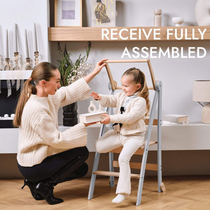 Woman and child with Goodevas Learning Tower in a home setting, text 'Receive Fully Assembled'.