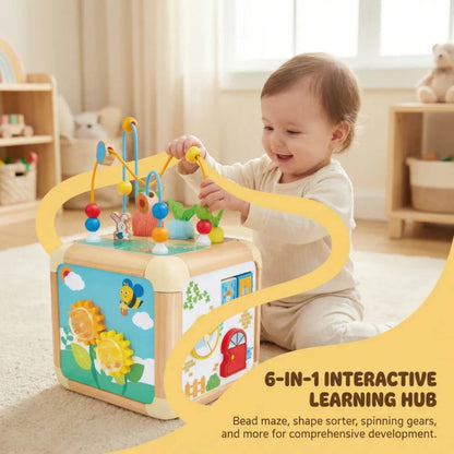 Child playing with Hape Green Thumbs Activity Cube in a bright room.