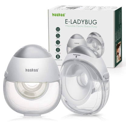 Haakaa E-Ladybug breast pump with packaging on a white background