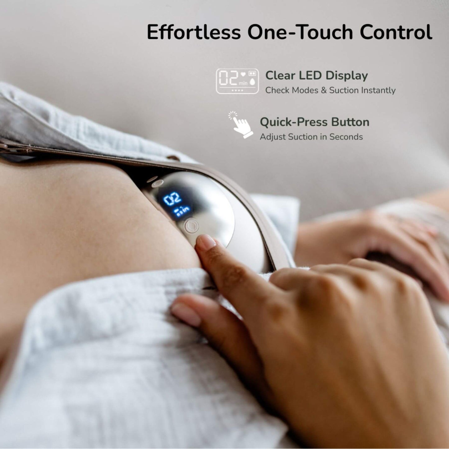 Person using a handheld device with a clear LED display and quick-press button on a neutral background.