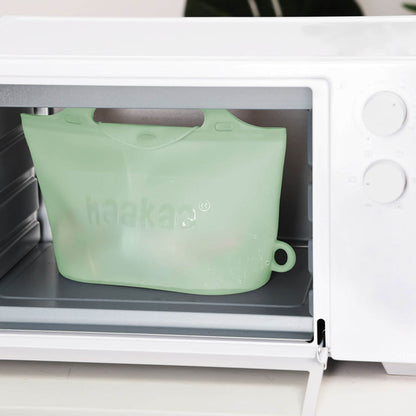 Haakaa Multipurpose Steamer & Steriliser Bag in a microwave