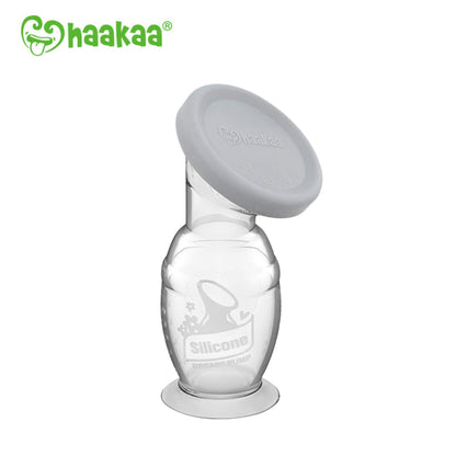 Silicone breast pump with gray cover on a white background, featuring the Haakaa brand.