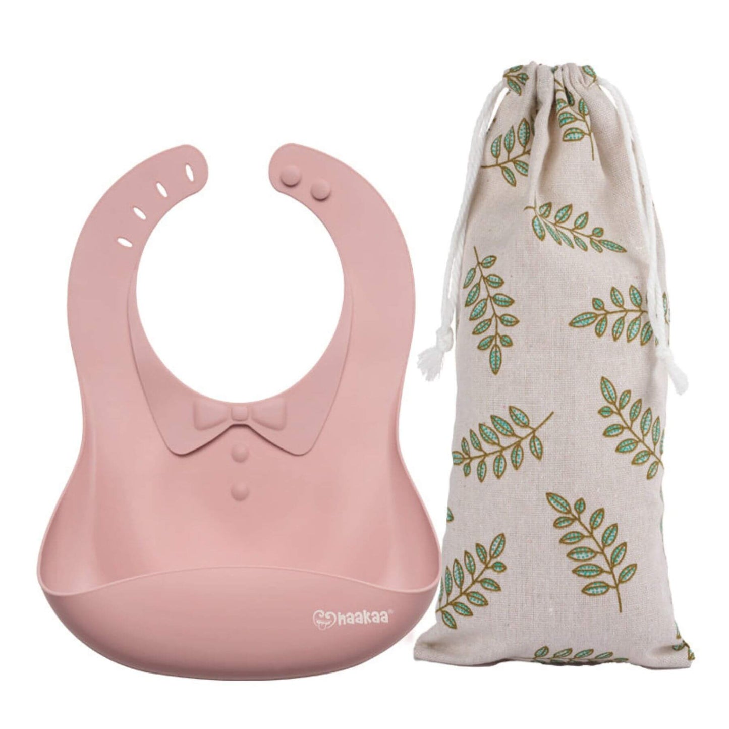 Haakaa Silicone Baby Bib - Blush with a matching storage bag featuring leaf patterns on a white background