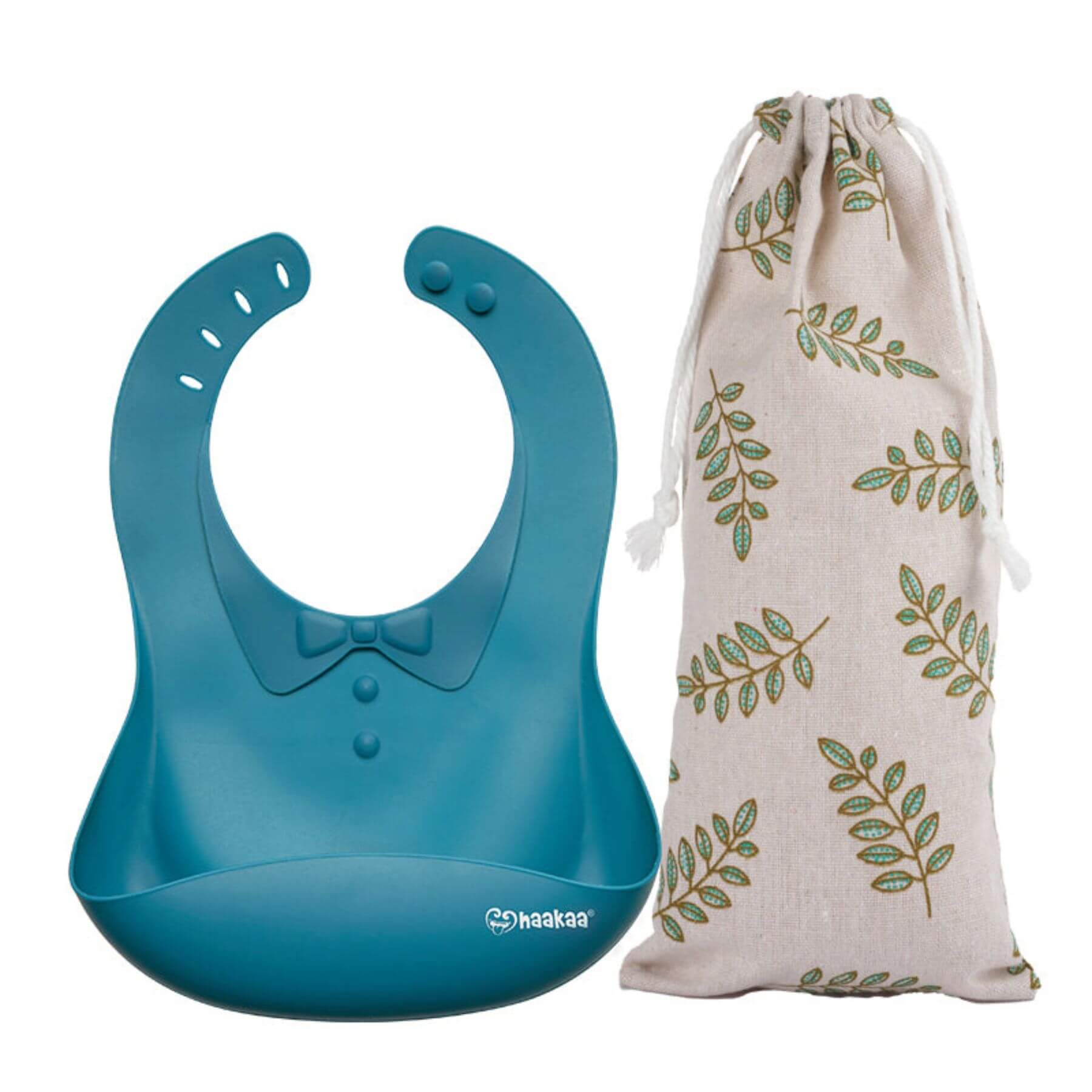 Haakaa Silicone Baby Bib - Cobalt, next to a drawstring bag with leaf pattern on a white background