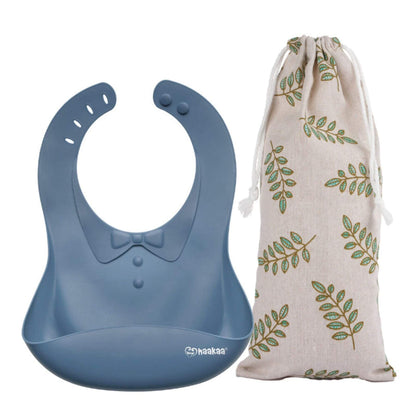 Haakaa Silicone Baby Bib - Bluestone and a drawstring bag with leaf pattern on a white background