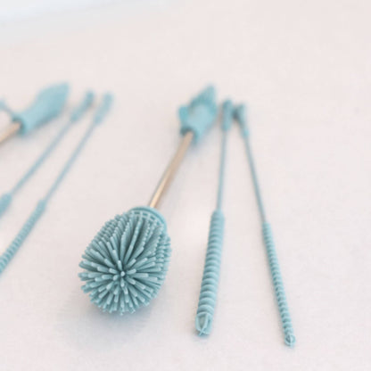Set of blue bottle brushes on a light background