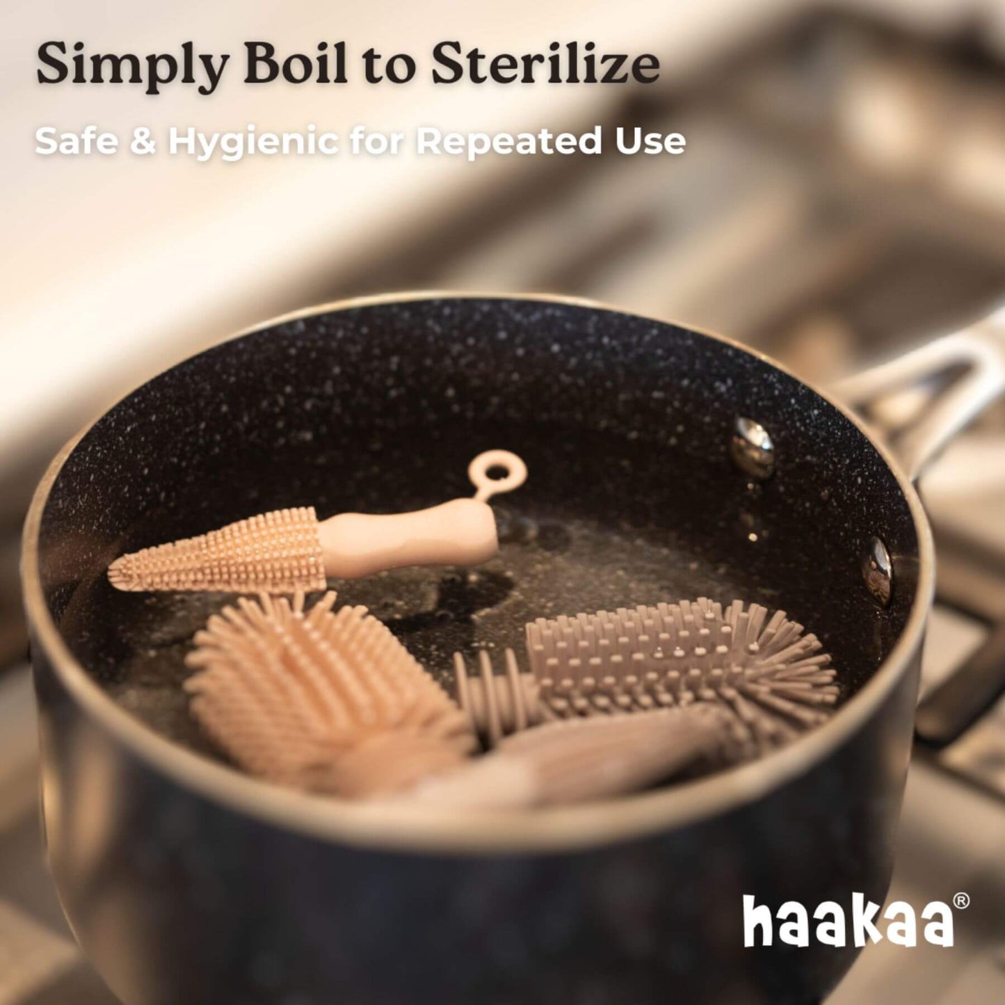 Haakaa silicone brushes being boiled in a pot with text about sterilization.