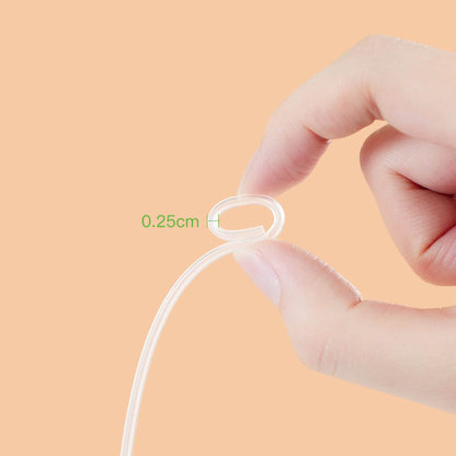 Hand holding a thin white cable with a measurement label on an orange background