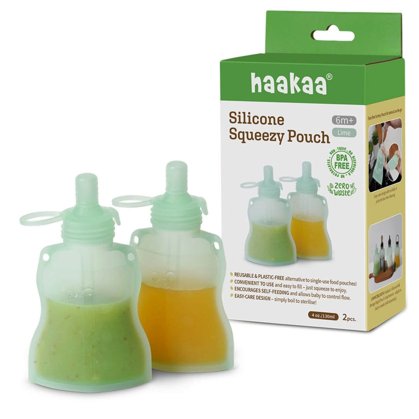 Haakaa silicone squeezable pouches with green and orange contents next to their packaging.