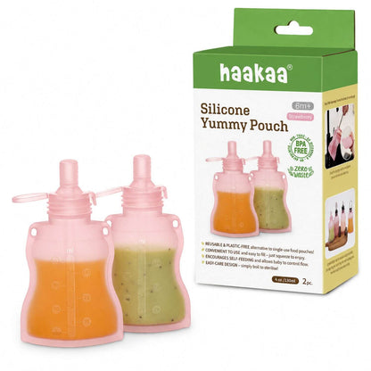 Pink silicone yummy pouches with a haakaa packaging box on a white background