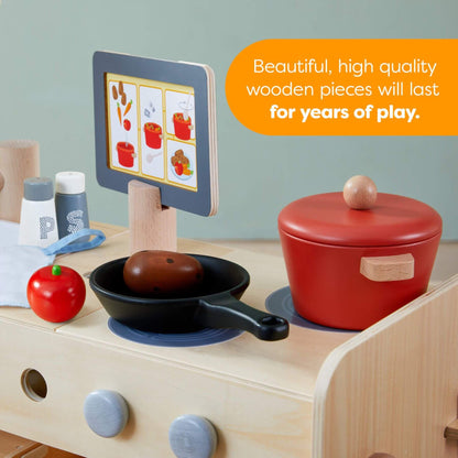 Wooden play kitchen set with toy food and cookware on a light blue background.