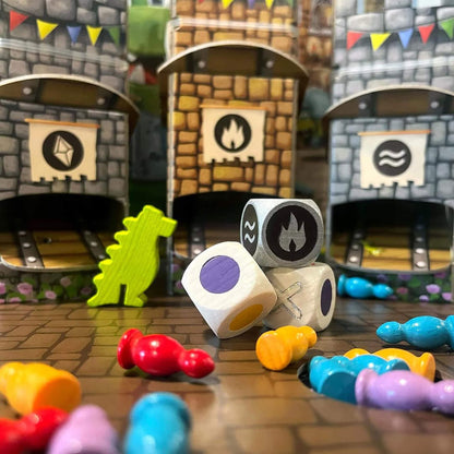 Colorful dice and game pieces on a table with a castle-like backdrop