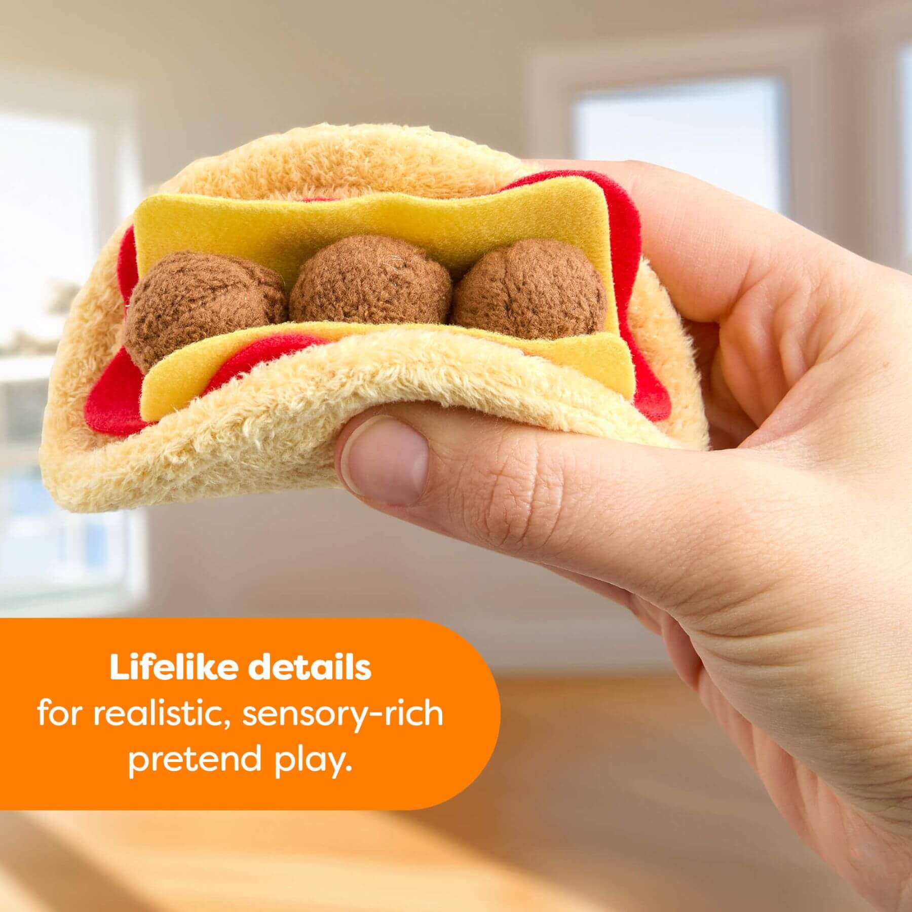 Hand holding a plush toy resembling a taco with text about sensory-rich pretend play.