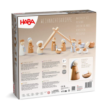 HABA nativity set packaging with wooden figures and stable on a beige background