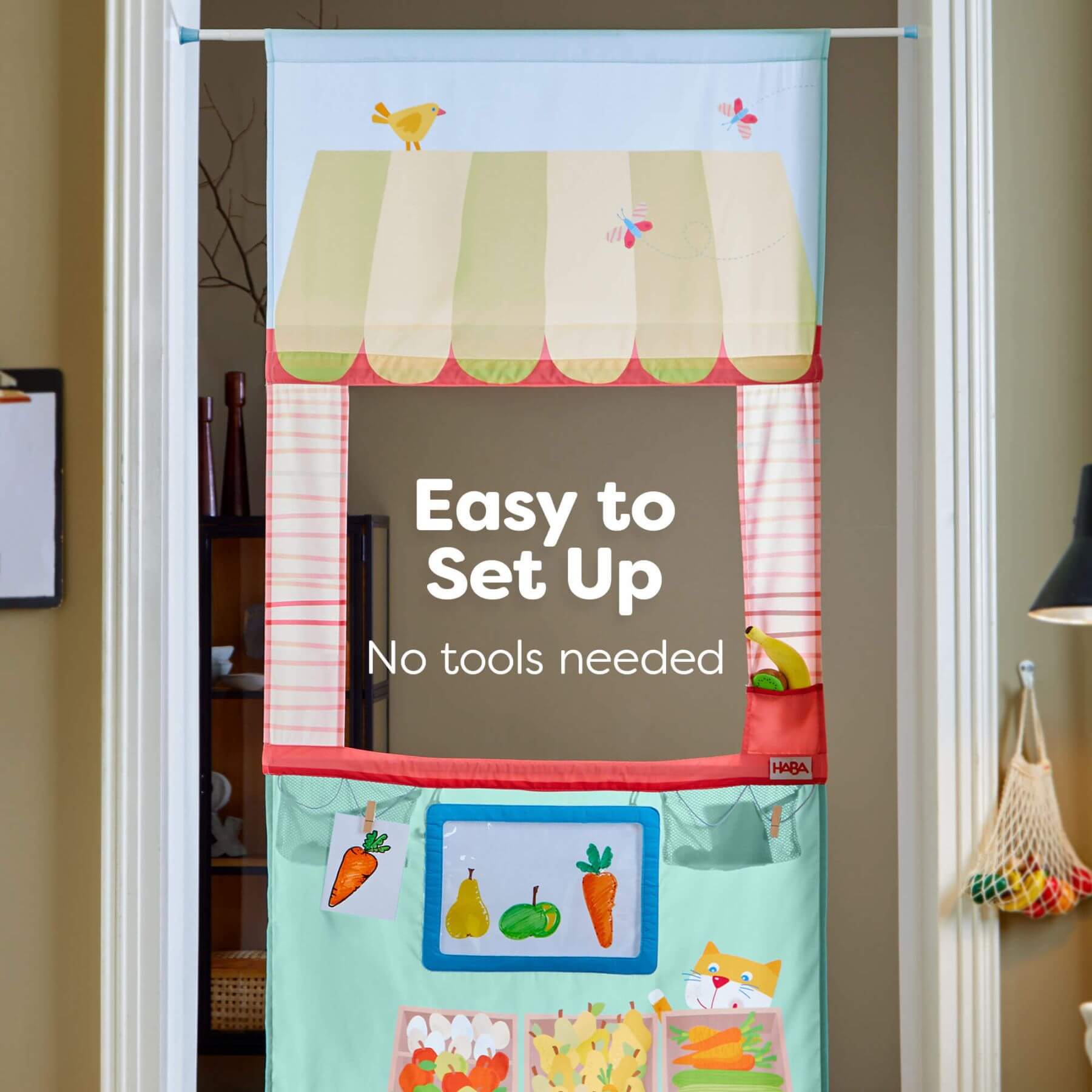 HABA USA Hanging Doorway Play Store with colorful design and text 'Easy to Set Up No tools needed' on a door.