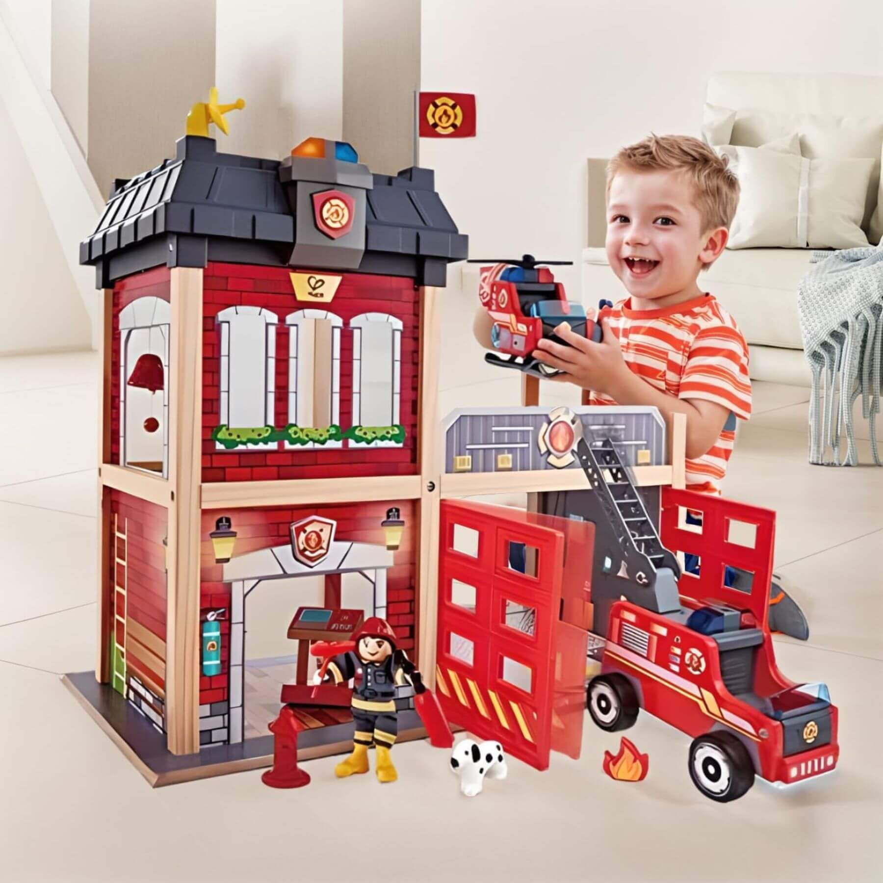 Child playing with Hape City Fire Station in a living room.