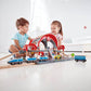 Kids Playing Hape Grand City Station