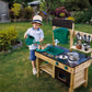 Boy Playing Hape Outdoor Kitchen