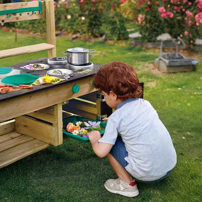 Boy Playing Hape Outdoor Kitchen