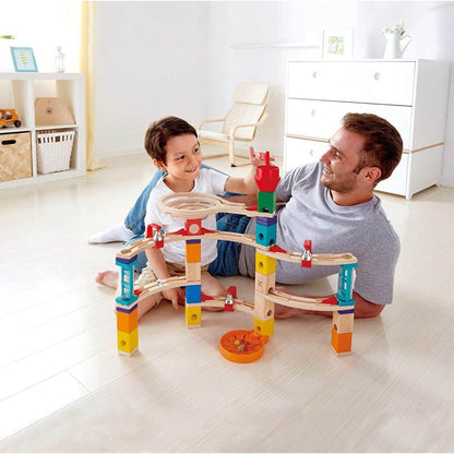 Dad & Boy Playing Hape Quadrilla Castle Escape Wooden Marble Run Blocks