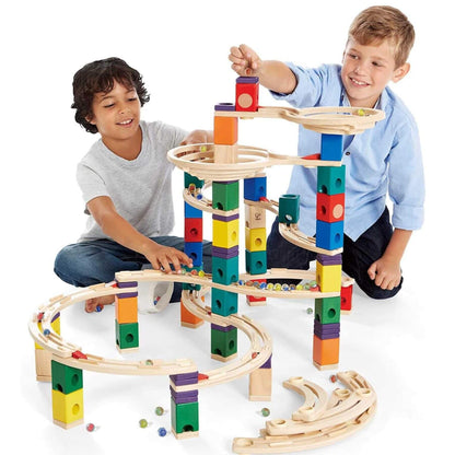 Boys Playing Hape Quadrilla Cyclone Wooden Marble Run Blocks