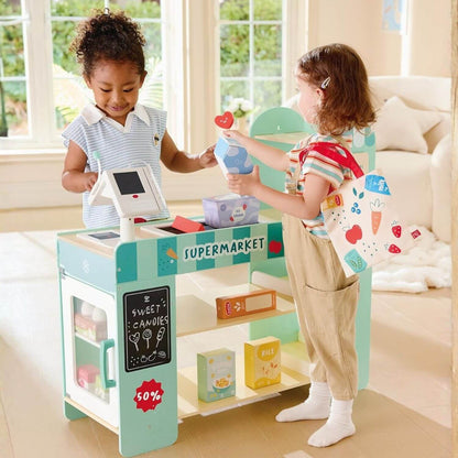 Two children playing with Hape Smart & Wooden Supermarket in a bright room.