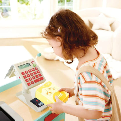 Child playing with Hape Smart & Wooden Supermarket