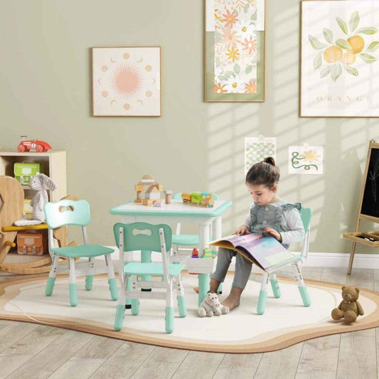 Girl Sitting at Qaba Height Adjustable 5pc Toddler Table and Chair Set, w/ Storage Box, Green