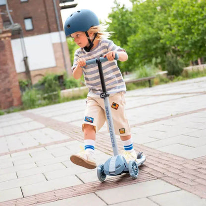 Kid riding on Highwaykick 3S Kids Scooter – Steel outdoor