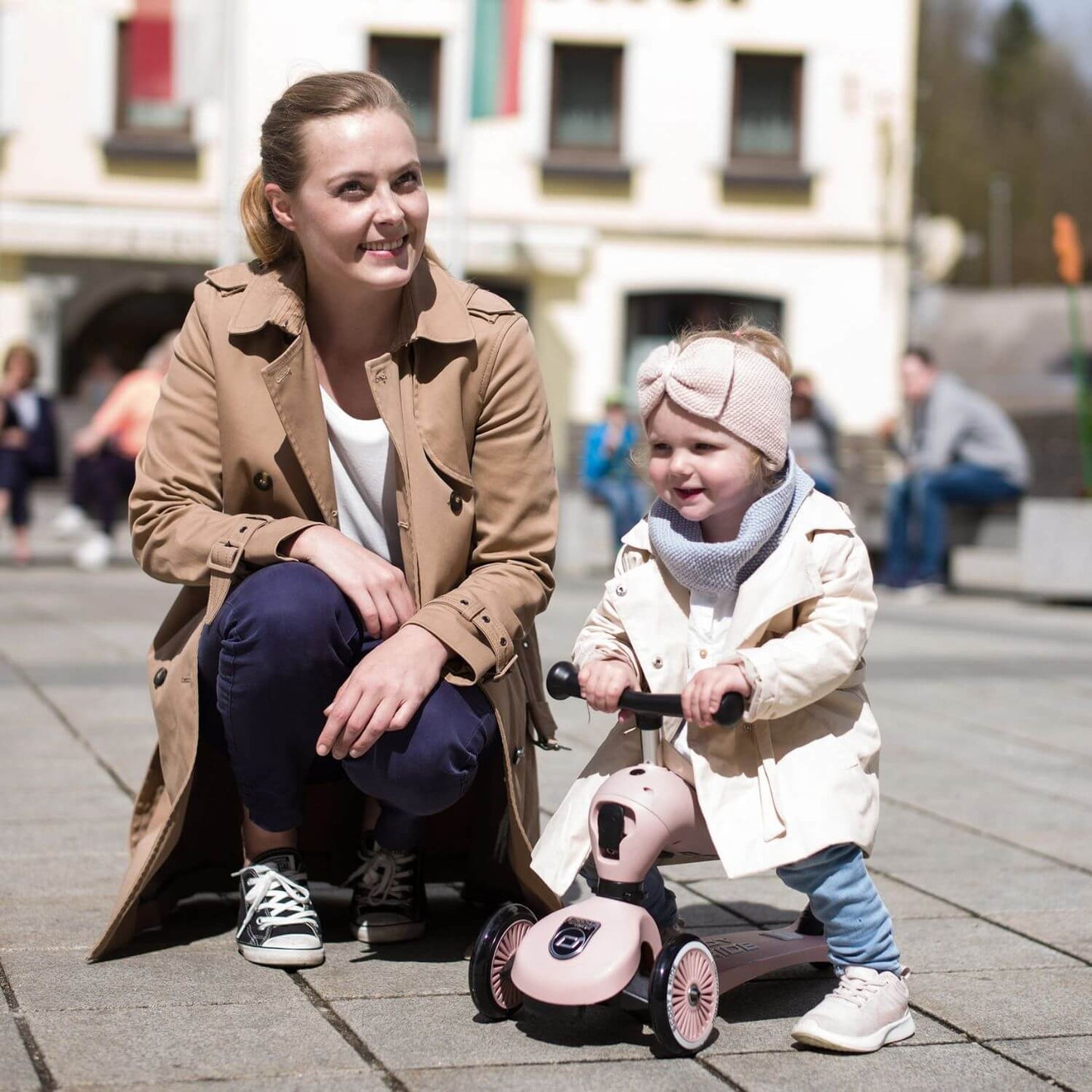Woman and kid palying HighwayKick 1 Scooter and Ride On Toy Rose