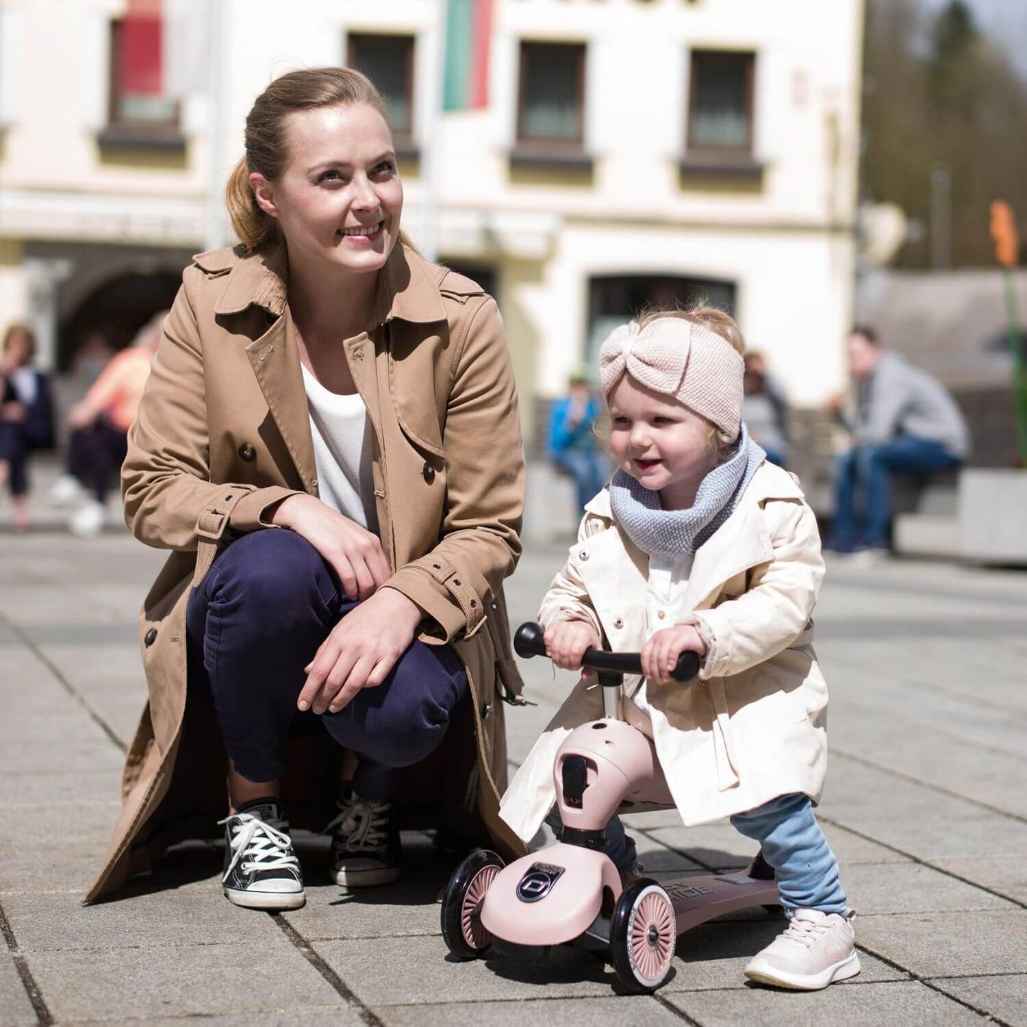 Woman and kid palying HighwayKick 1 Scooter and Ride On Toy Rose